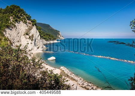 Beach Of Numana Alta, On The Italian Riviera With The White Cliffs And Clear Blue Water Of The Adria