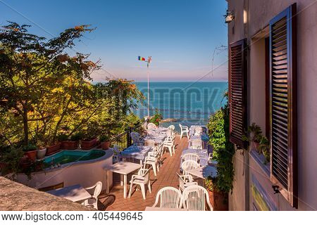 A Sunny Restaurant Outdoor Terrace Overlooking The Adriatic Sea On The Italian Riviera, Numana, Marc