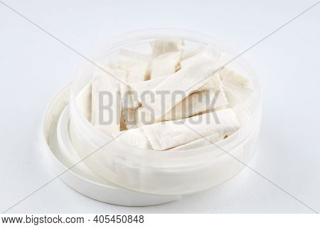 Snus Nicotine Bags. Chewing Tobacco Product Over White Background. Alternative To Smoking Cigarettes