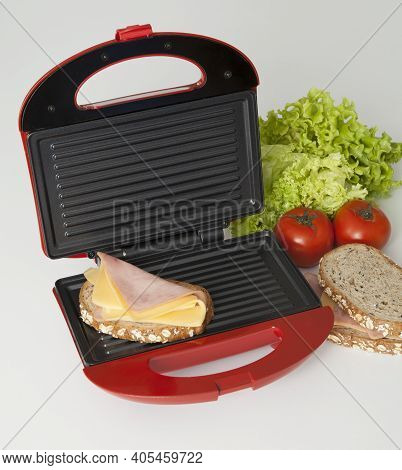 Sandwich Maker Red; Photo Set With Ingredients To Make Sandwiches