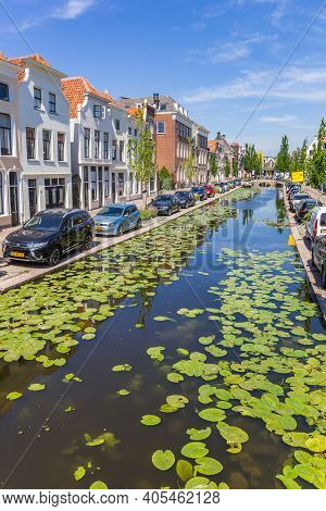 Gouda, Netherlands - May 21, 2020: Water Plants In The Turfmarkt Canal In Historic City Gouda, Nethe