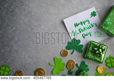 Decorative Clover Leaves, Green Gifts Box, Coins On Stone Background, Flat Lay. St. Patrick's Day Ce
