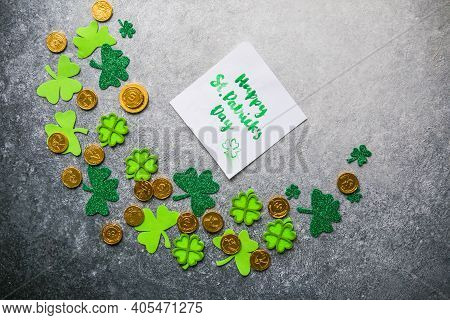 Decorative Clover Leaves, Green Gifts Box, Coins On Stone Background, Flat Lay. St. Patrick's Day Ce