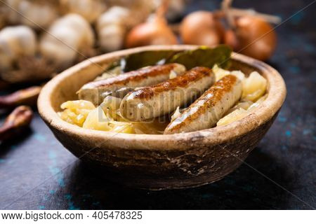 Grilled german sausage links served with sauerkraut or sour cabbage
