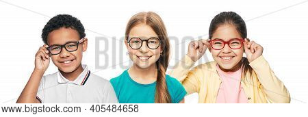 Group Of Smiling Multiethnic Kids Wearing Modern Eyeglasses On White Background. Childrens Vision Co