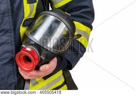 Full Protective Breathing Mask In Hand Of Unrecognized Firefighter, Rescue And Fire Fighter Equipmen