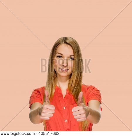 Young Attarctive Smiling Girl Showing Two Thumbs Up