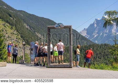 Fernpass, Austria - Aug 6, 2020: Tourists Stop To See West Side Zugspitze At Viewpoint