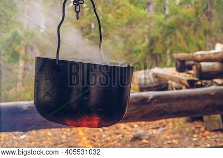 Camping Pot On Fire. Outdoor Steaming Food. Wildlife Lifestyle Cooking Delicious Meal, Copyspace Sto