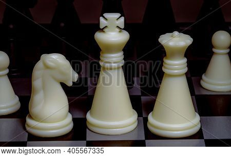 An Image Of Black And White Chess Pieces On A Chessboard.