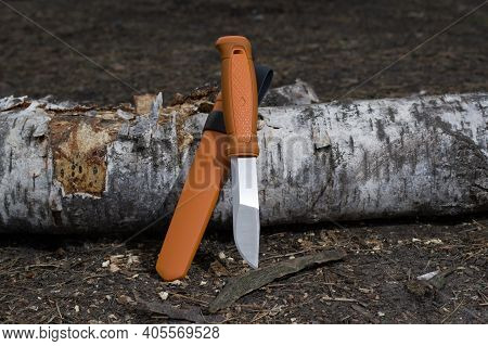 Fixed Blade Knife. Knife With Orange Handle And Plastic Sheath. Orange Case And Knife.