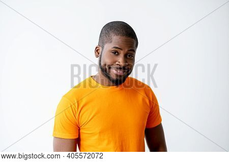 Happy Man Portrait. Good News. Positive Attitude. Cheerful Surprised Satisfied African Guy In Bright
