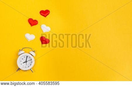 Alarm Clock And Hearts On Yellow Background. Place For Text. Top View. Time For Love