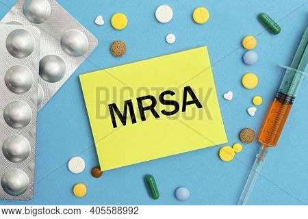 Card With Text Mrsa Methicillin-resistant Staphylococcus Aureus, Pills And Syringe. Medical Concept.