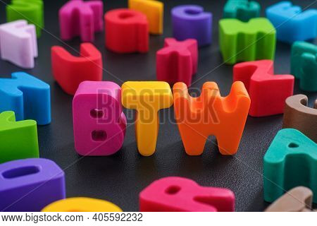 The Abbreviation Btw (by The Way) Made Out Of Polymer Clay Letters. Close Up.