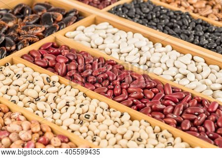 Different Beans In The Wooden Box. Black Eyed, Borlotti, Black Turtle, Red Kidney, Scarlet Runner.