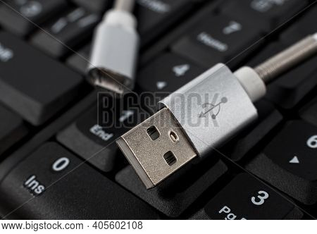 The Usb Cable For Charging Peripherals Is Located On The Keyboard In Black. Charging For Your Phone