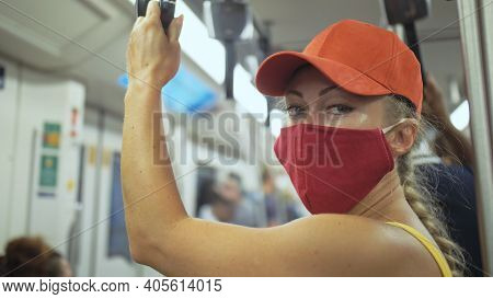 Woman Travel Caucasian Ride At Overground Train Airtrain With Wearing Protective Medical Mask. Girl 