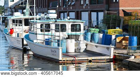 Portland, Maine, Usa - 25 July 2020: Fishing And Lobster Boats Docked In An Inlet In The City Of Por