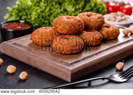 Beautiful Delicious Fresh Chickpea Falafel With Sauces On A Concrete Background