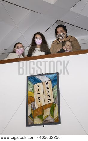 Jerusalem, Israel - January 28th, 2020: A Woman And Three Girls In The Ladies Section Of A Synagogue