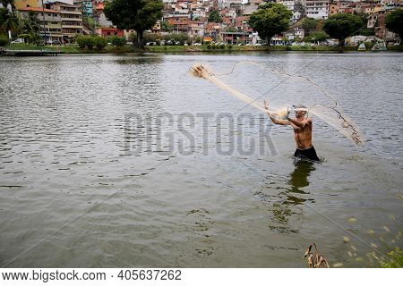 Fisherman On Lake Fishing
