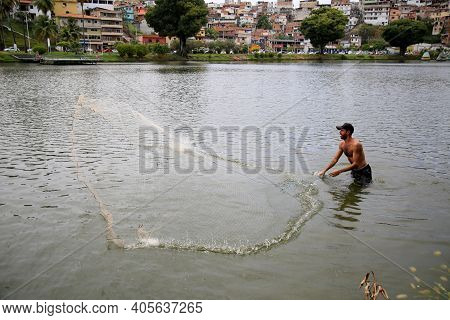 Fisherman On Lake Fishing