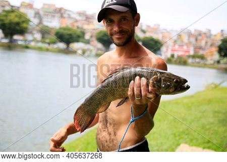 Fisherman On Lake Fishing