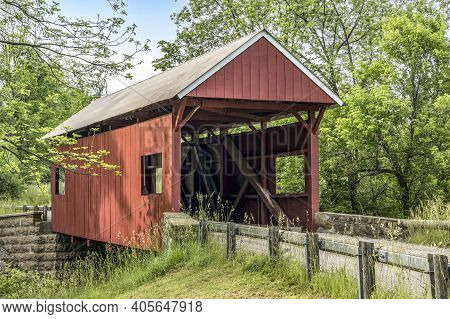The Historic Red Erskine Covered Bridge Crosses Middle Wheeling Creek In Rural Wooded Washington Cou