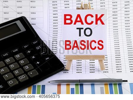 Back To Basic On Small Easel With Charts, Pen And Calculator.business