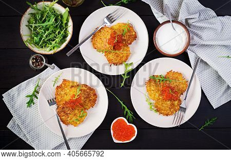 Fried Potato Pancakes With Red Caviar And Sour Cream, Fritter, Roesti. Traditional Delicious Food, L