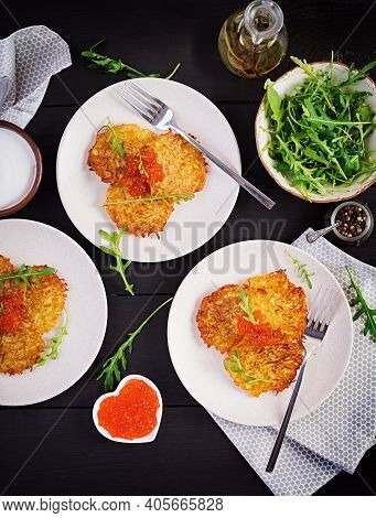 Fried Potato Pancakes With Red Caviar And Sour Cream, Fritter, Roesti. Traditional Delicious Food, L