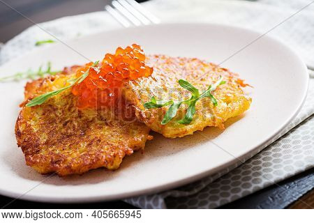 Fried Potato Pancakes With Red Caviar And Sour Cream, Fritter, Roesti. Traditional Delicious Food, L