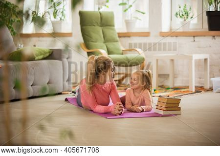 Resting, Laughting Together. Young Woman Exercising Fitness, Aerobic, Yoga At Home, Sporty Lifestyle
