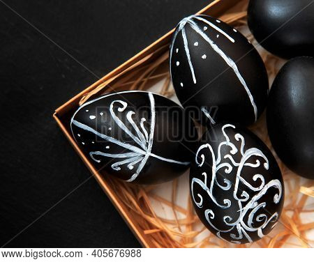 Creative Trendy Painted Easter Eggs On Black Background. Easter Ideas. Background With Easter Eggs.