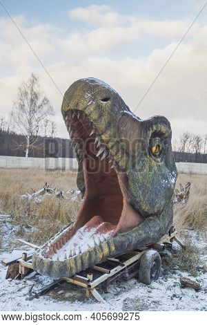 Bila Tserkva, Ukraine, January, 2020: Abandoned Huge Head Of Decorative Dinosaur On Winter Lawn