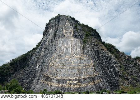 Golden Buddha Laser Carved On Khao Chee Chan Cliff, Sattahip, Chonburi Province, Thailand. Thai Lang