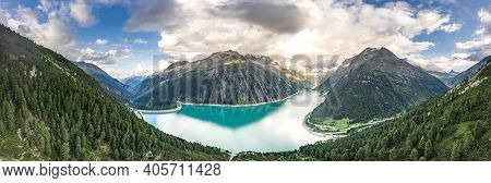 Aerial Panorama Drone Shot Of Schlegeisspeicher Resevoir With Galcier View At Dusk