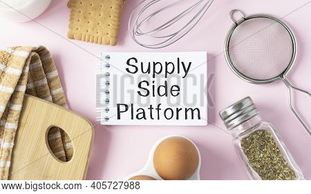 Cooking Utensils And Notepad On Pink Table And Tablet With Text Ssp Supply Side Platform. Culinary C