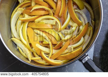 Orange And Lemon Peels Slices And Placed In A Pan Of Boiling Wather And Sugar To Make Candied Peels