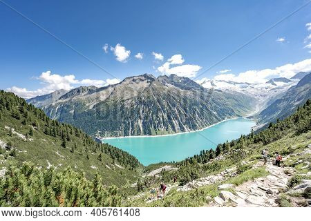 Zillertal, Austria - Aug 7, 2020: Trekkers On The Way Up To Olpererhutte