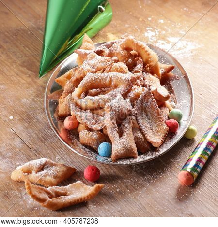 fried bugne with sugar and carnival decoration