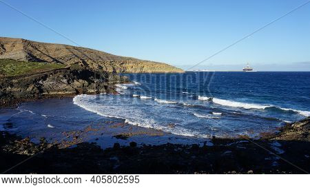 The Seacoast Of Montaña Pelada, Tenerife, Canary Islands, Spain. Blue Ocean, Waves And Volcanic Hill
