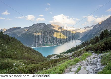 Zillertal, Austria - Aug 7, 2020: Trekkers On The Way Down From Olpererhutte In Summer