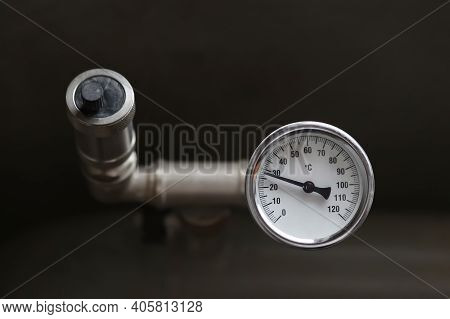 A Device For Measuring The Temperature Of Water In The Heating System. Pipe Pressure Relief Valve.
