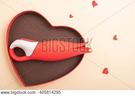 Valentines Day Gift. Flat Lay Clitoral Vibrator In A Heart Shaped Box