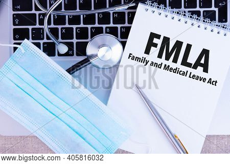 Fmla Family Medical Leave Act, The Text Is Written In A Notebook, Next To A Pen, A Disposable Medica