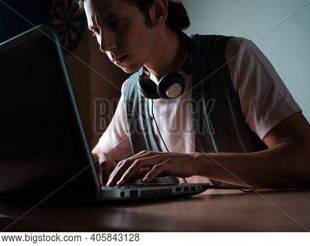 Write Code And Learn Programming Languages. A Student Or Specialist Is Doing A Project.