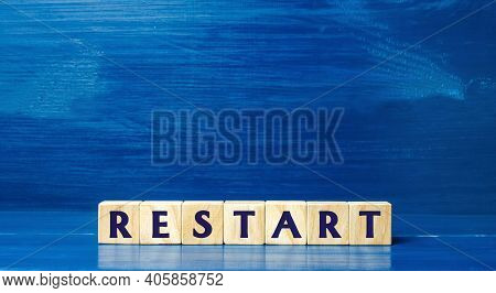Wooden Blocks With The Word Restart. New Beginning And Launch. Start Of A New Process. Back To The R
