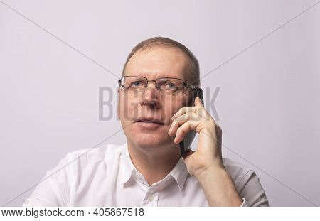 Smiling Happy Man Talking On Mobile Phone In White Shirt